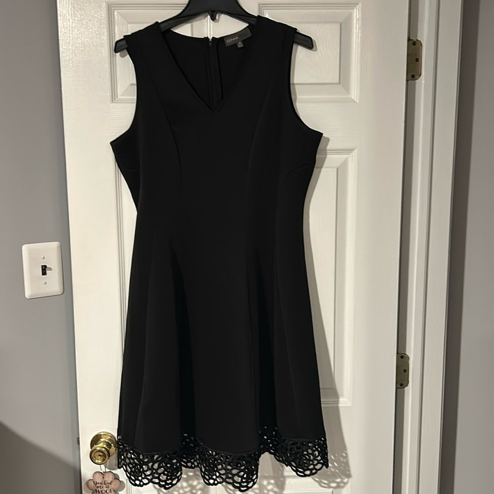 Black sleeveless dress size 16 withh a beautiful trim at the bottom